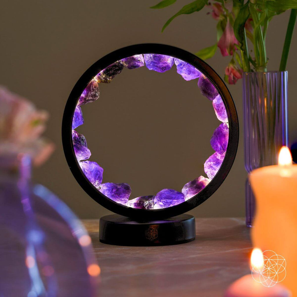 Amethyst Halo Desk Lamp glowing on a nightstand